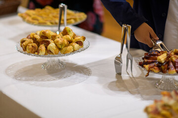 Delicious Assortment of Appetizers and Desserts Served at a Buffet or Catering Event Ready for Guests to Enjoy a Variety of Savory and Sweet Treats