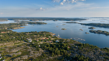 Aerial View of Coastal Archipelago Landscape in Str&ouml;mstad, Sweden with Rocky Islands, Forests, and Calm Blue Water on a Clear Summer Day
