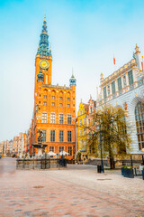 Naklejka premium Gdansk with Motlawa river in Poland. Old town colourful house with saint Marys church i main square.