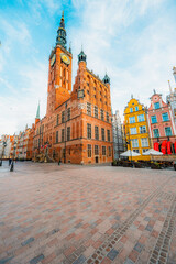 Naklejka premium Gdansk with Motlawa river in Poland. Old town colourful house with saint Marys church i main square.