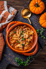 Warm stew with meat, cabbage and pumpkin, comfort autumn dinner balanced food