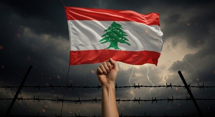 Raised fist with the flag of lebanon and barbed wire fence.