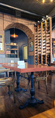 Cozy restaurant interior with wine rack and rustic furniture