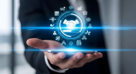 Fototapeta premium Modern business handshake on phone screen shows digital partnership deal