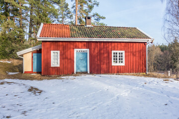 Idyllic old red croft with snow in the winter © Lars Johansson