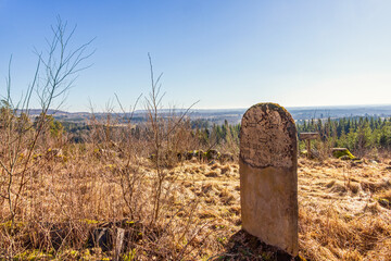 Boundary stone for a nature park on a hill with a beautiful view