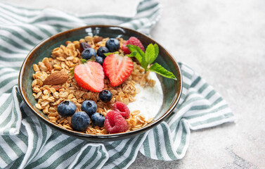 Granola bowl with yogurt, berries, and mint