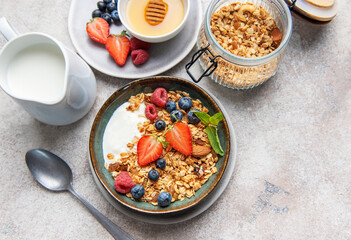 Granola bowl with yogurt berries and honey