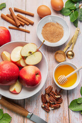 Baking ingredients for apple dessert on wooden table