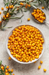 Sea buckthorn berries in bowl healthy eating concept