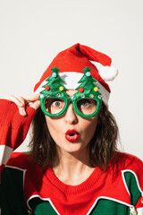 Woman Wearing Christmas Tree Glasses and Santa Hat
