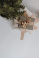 Neutral Toned Gift Box with Ribbon. Holiday background with blank copy space. Flat lay, top view