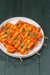 Sotteok so-tteok (소떡소떡), sometimes translated as sausage and rice cake, is a popular South Korean street food consisting of garae-tteok (rice cake) and Vienna sausage skewered and fried