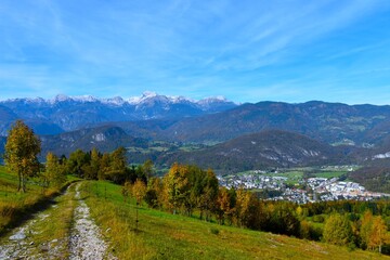 Obraz premium View of Triglav mountain in Julian alps and Bohinjska Bistrica town bellow the hills in Gorenjska, Slovenia