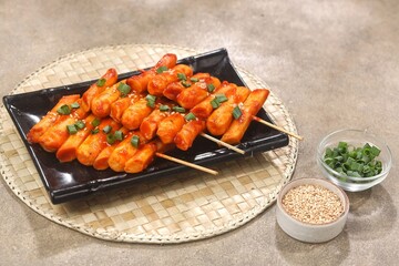 Sotteok so-tteok (소떡소떡), sometimes translated as sausage and rice cake, is a popular South Korean street food consisting of garae-tteok (rice cake) and Vienna sausage skewered and fried