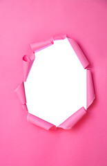 A torn pink paper background with an empty white space in the center. The edges are irregular and curled, creating a playful and vibrant look.