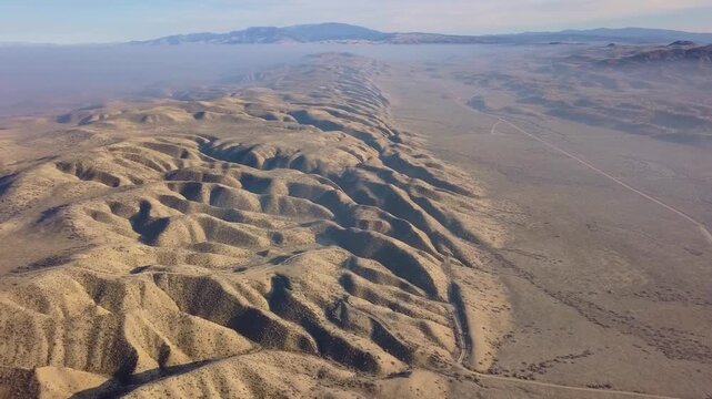  drone footage showing the dramatic Temblor Range in the Carrizo Plain National Monument, California. The video captures the striking folds, ridges, and fault lines carved by the San Andreas Fault.