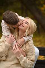 Fototapeta premium mother and son playing in the autumn park