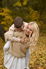 Fototapeta premium mother and son playing in the autumn park