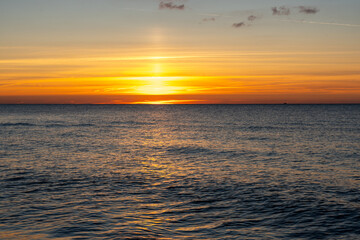Romantic Baltic Sea sunset in Prerow with soft waves golden beach light and peaceful coastal atmosphere at twilight