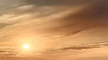 Obraz premium Sun descends through a sky of warm, swirling clouds.