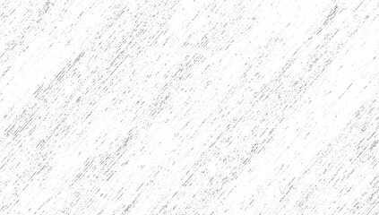 A white surface with a dense pattern of fine diagonal gray lines and scattered speckles.