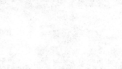 A white surface with a sparse, random distribution of small black dots creating a textured effect.