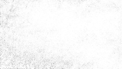 White background with a distribution of dark speckles and irregular shapes.