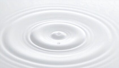 A pristine white liquid surface ripples outward from a central point, creating concentric circles