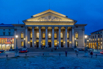 Bavarian State Opera illuminated at blue hour in Munich Germany