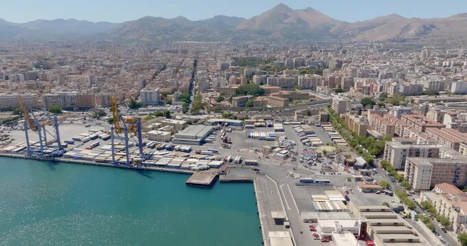 Aerial view of the port of Palermo, Sicily, Italy. There are many boats, ferries, and cruise ships in the harbor.