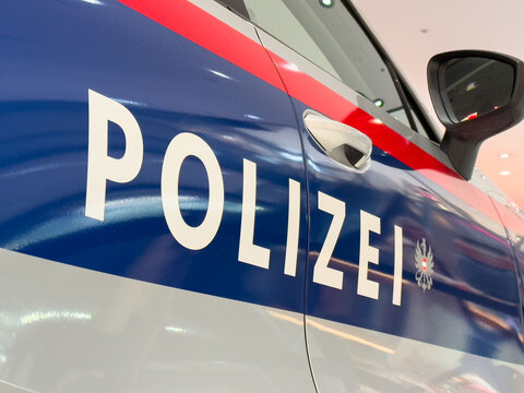 Villach, Austria - October 09, 2025: Close-up view of a police car with the word Polizei prominently displayed, showcasing the vehicle's design and colors in a modern urban setting