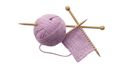 Pink yarn ball with knitting needles and partially knit textile on black