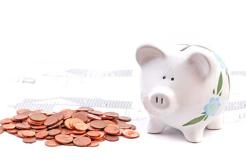 Money box - a piggy bank with coins and building plans.