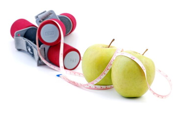 Apples and dumbbells, weight loss and health concept