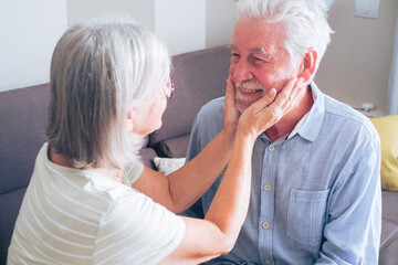 Senior couple spending quality time together at home, sharing a tender and loving moment that reflects affection, companionship, and a healthy, peaceful retired lifestyle