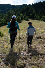 Child boy and girl hiking in scenic nature