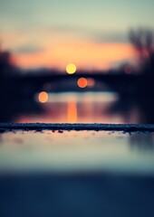 Blurry sunset over water and bridge