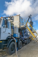 The Northern gas field. Summer. Installation for lowering a flexible pipe into a well. Equipment for testing and development of a gas well