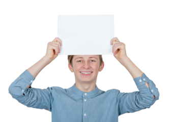 Contented teenage boy keeps a blank paper sheet over head. Male adolescent portrait holding an empty banner placard, isolated on transparent background