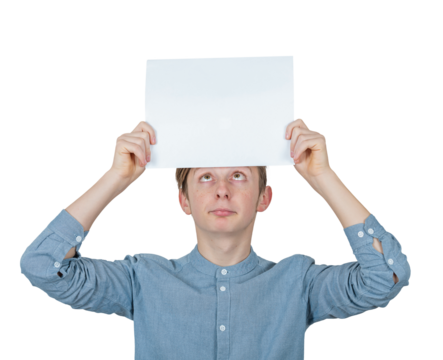 Confused teenage boy keeps a blank paper sheet over head looks up bewildered. Male adolescent portrait holding an empty banner placard, isolated on transparent background