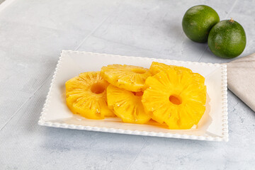 Sweet canned pineapple slices in syrope