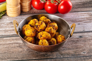 Baked small baby potato with herbs