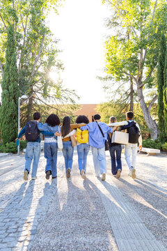 Diverse students walking together, arms around shoulders