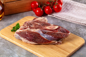 Raw lamb steak with bone