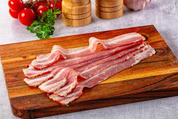 Raw bacon pork meat slices