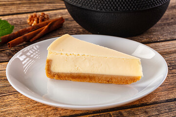 Classic delicous cheesecake slice served mint