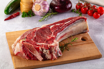 Raw prime beef steak with bone