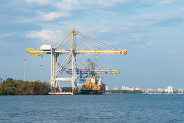 Industrial harbor for container ship in Kochi, India, cargo terminal, transport, import and export, Fort Kochi, Vasco da Gama beach 