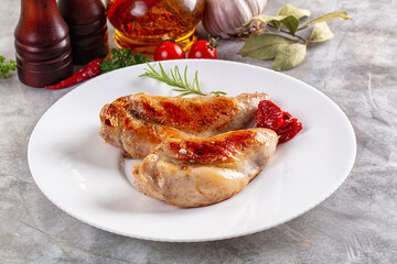 Roasted rabbit leg served rosemary